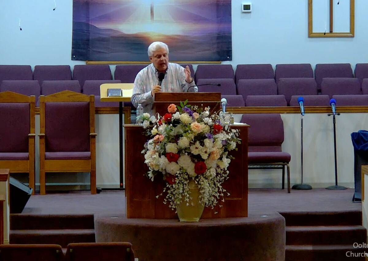 Willard Griffin preaching.