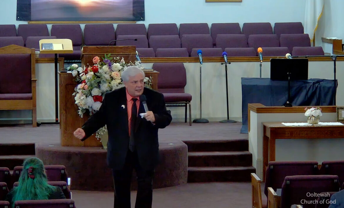 Willard Griffin preaching.