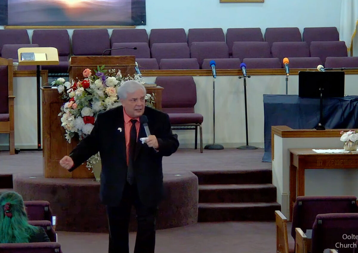 Willard Griffin preaching.