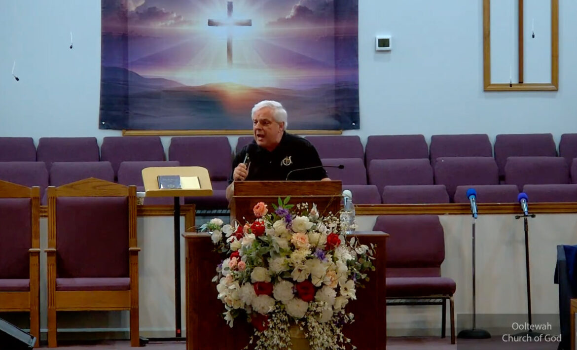 Willard Griffin preaching.