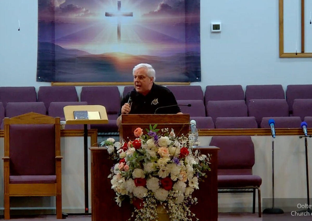 Willard Griffin preaching.