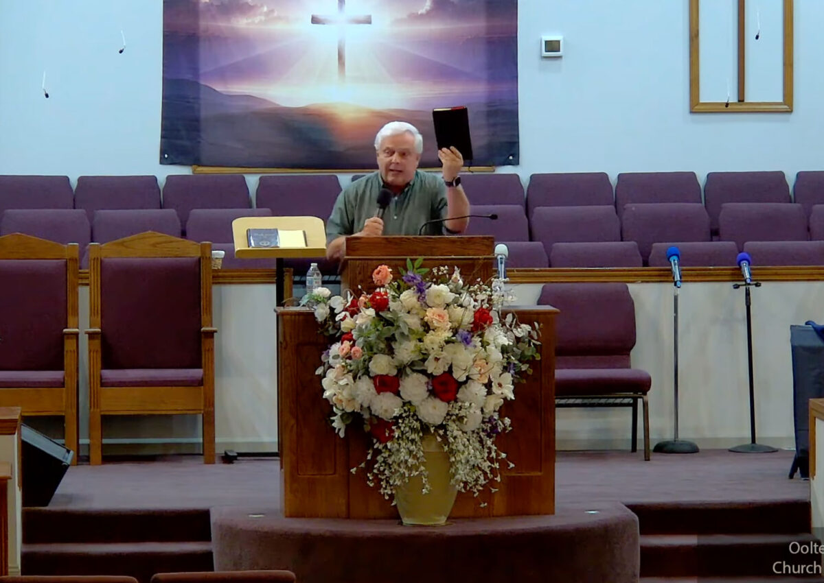 Willard Griffin preaching.