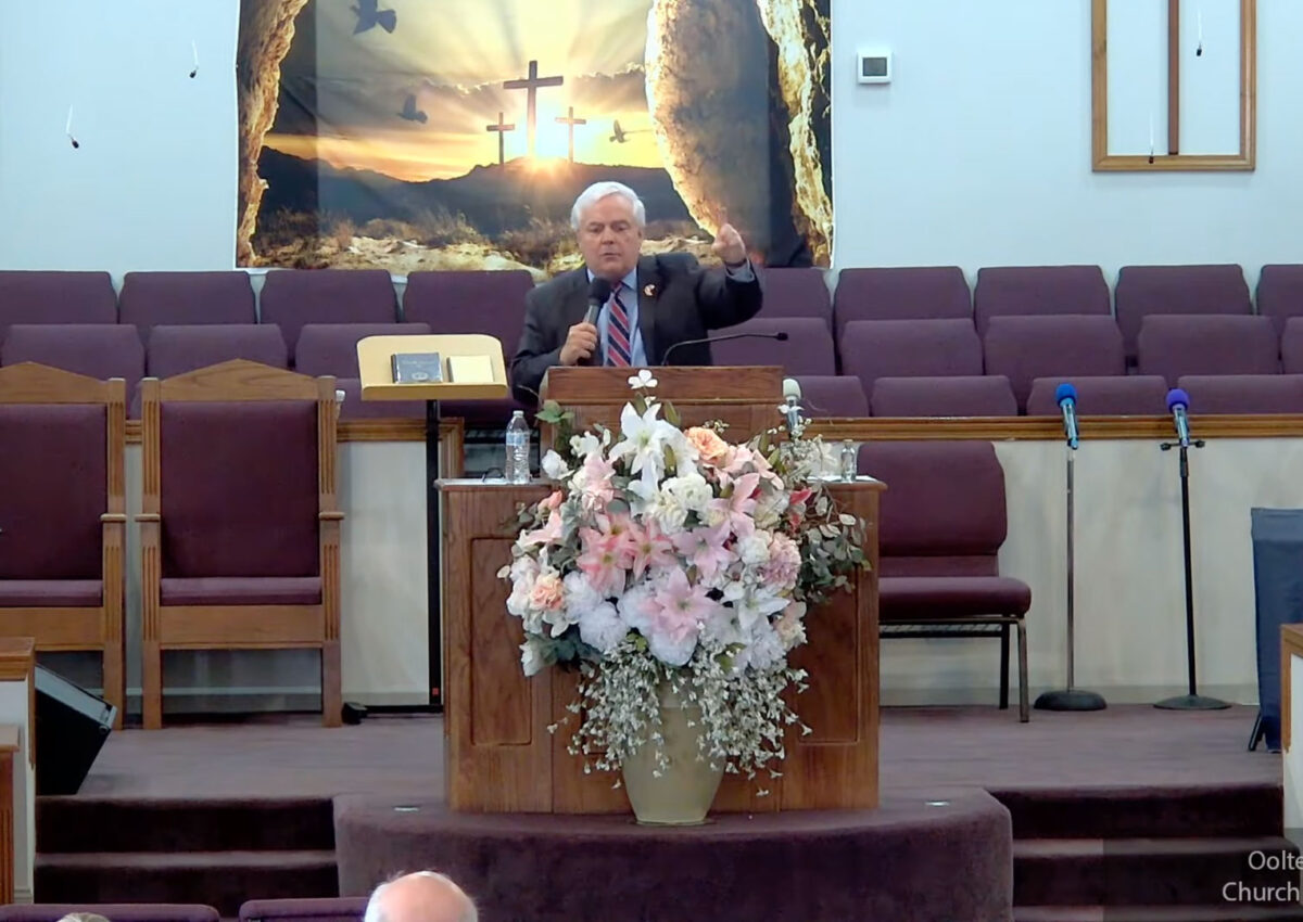 Willard Griffin preaching.