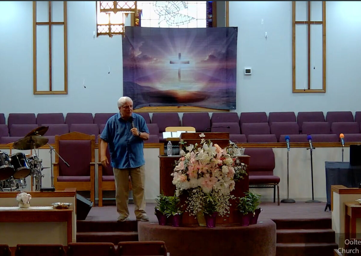 Willard Griffin preaching.