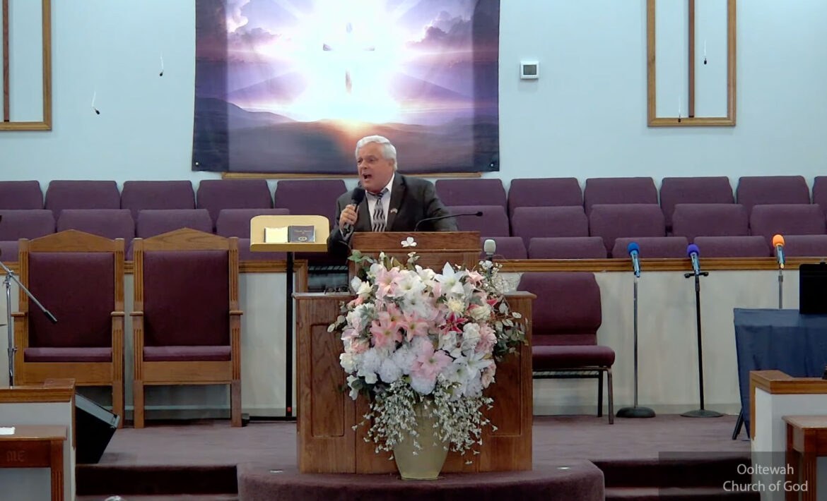 Willard Griffin preaching.