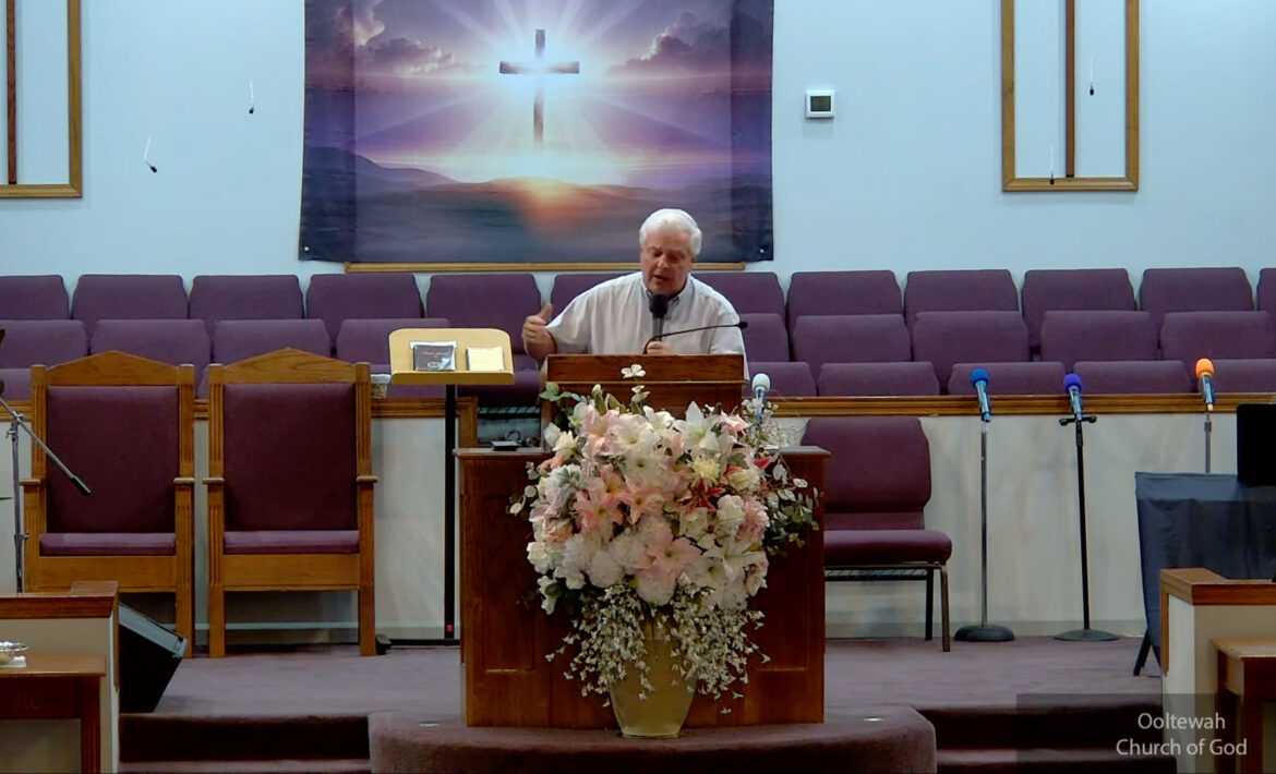 Willard Griffin preaching.