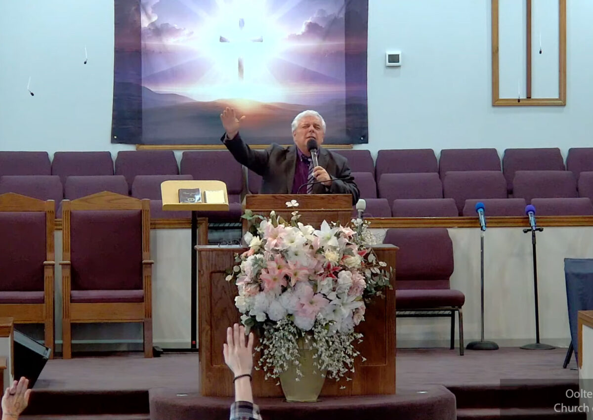 Willard Griffin preaching.