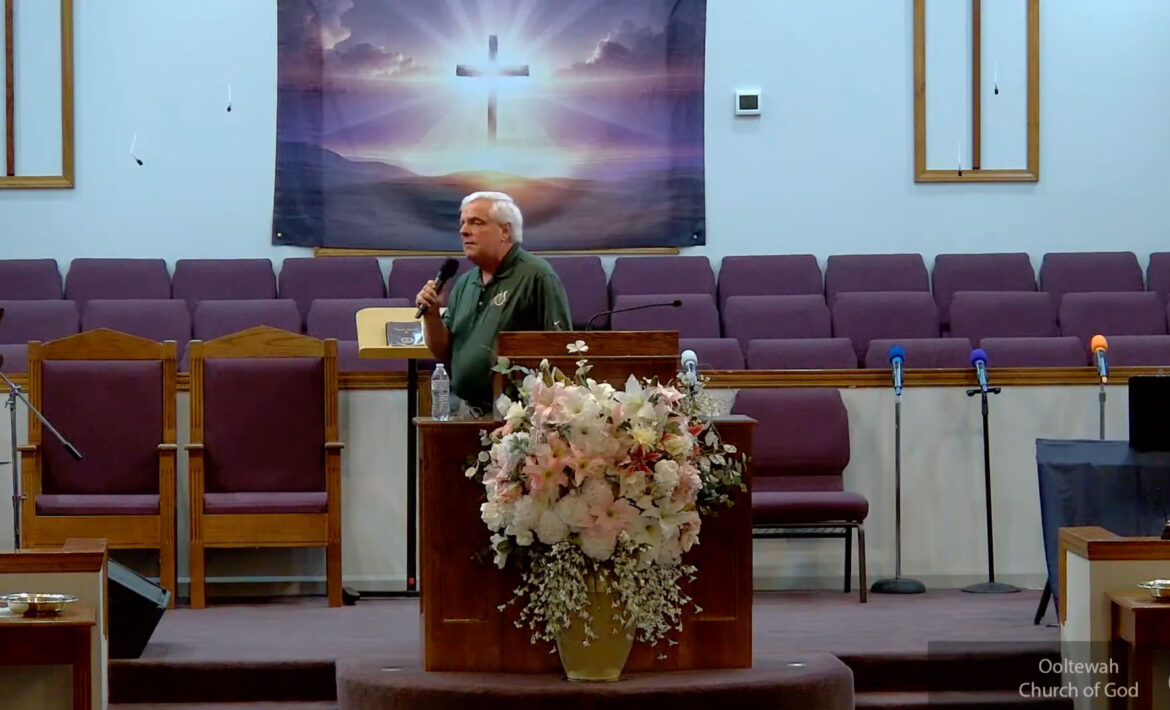 Willard Griffin preaching.