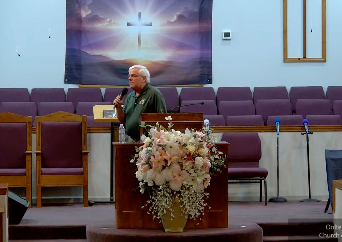 Willard Griffin preaching.