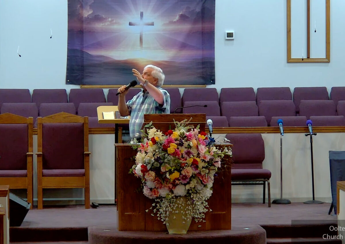 Willard Griffin preaching.
