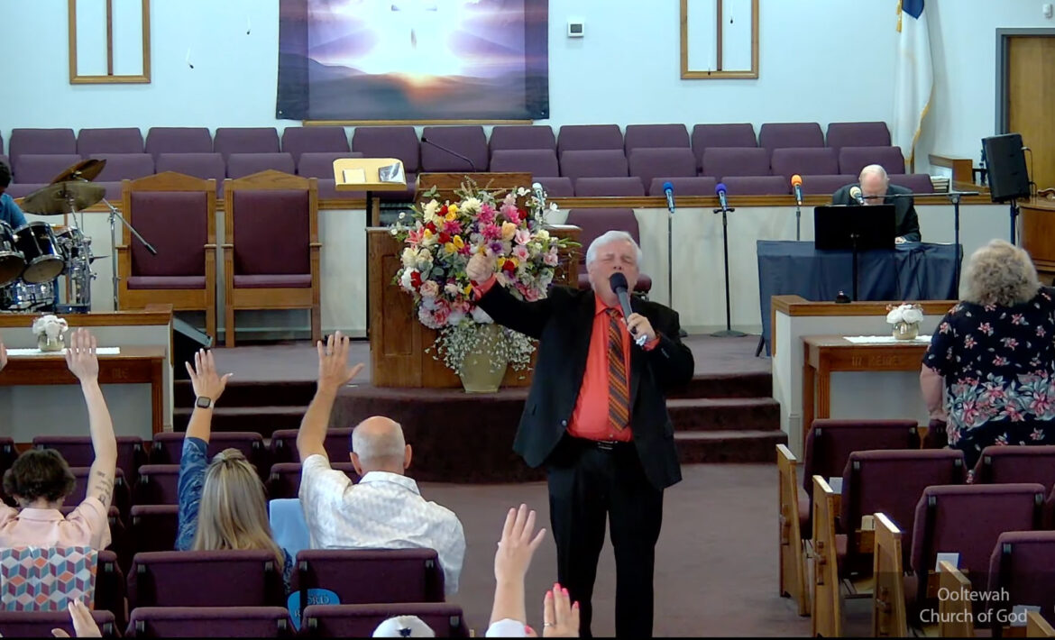 Willard Griffin preaching.