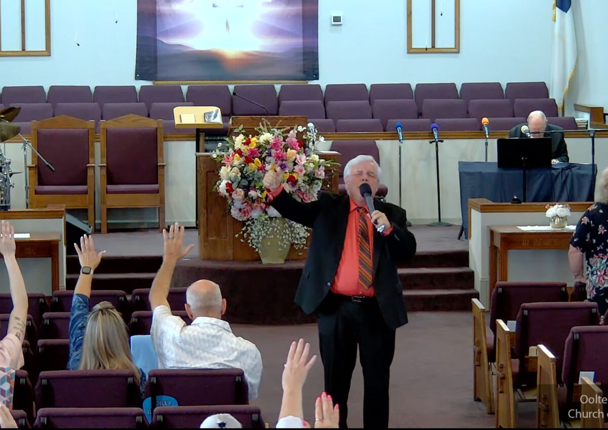 Willard Griffin preaching.