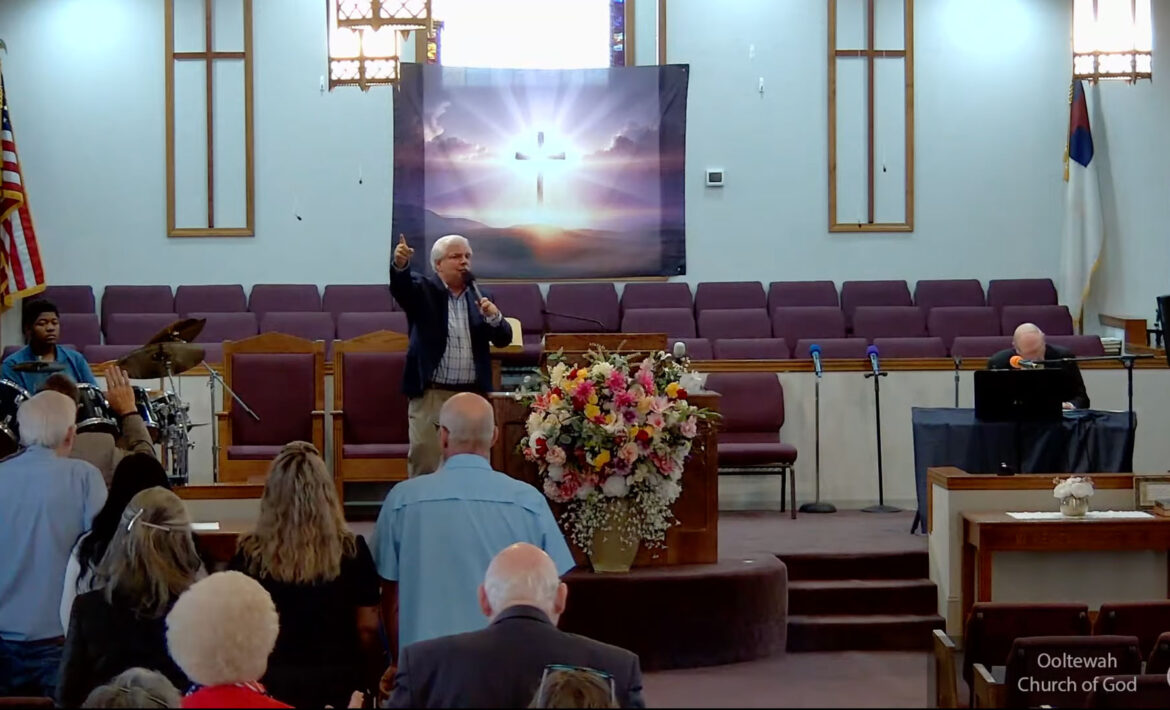 Willard Griffin preaching.
