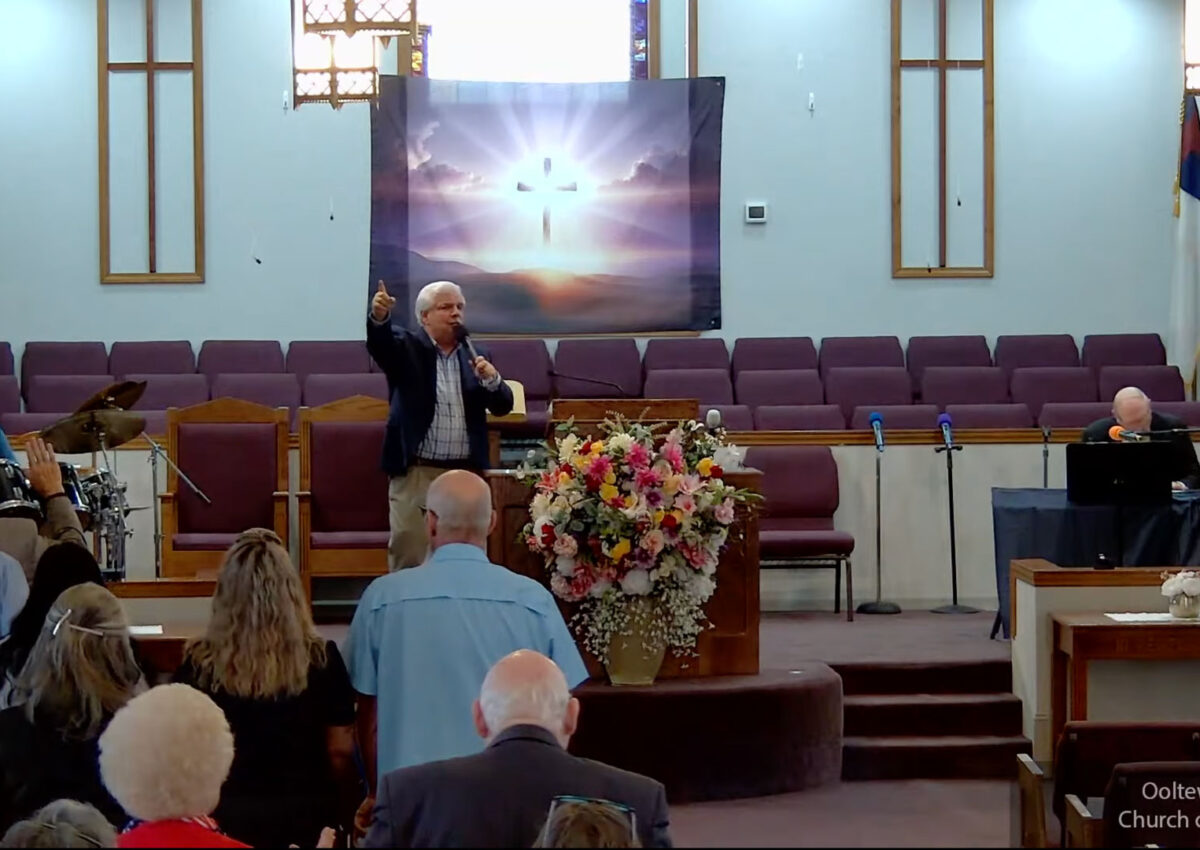 Willard Griffin preaching.