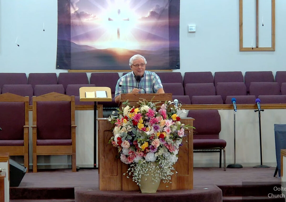 Willard Griffin preaching.