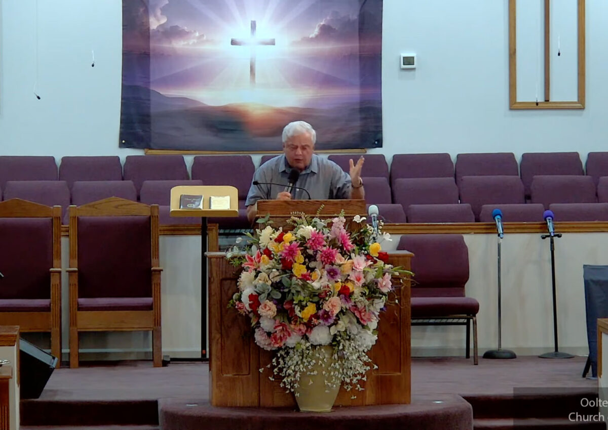 Willard Griffin preaching.