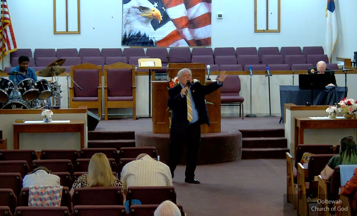 Willard Griffin preaching.