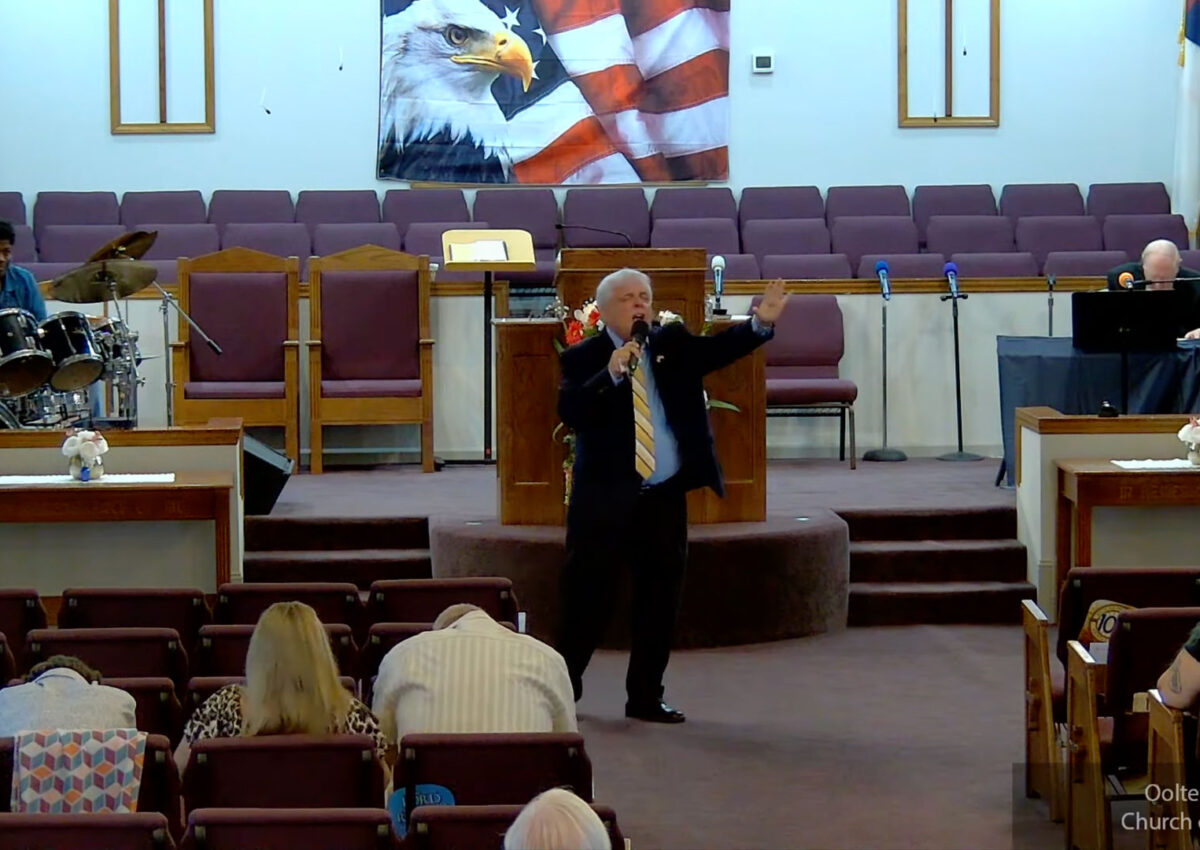 Willard Griffin preaching.