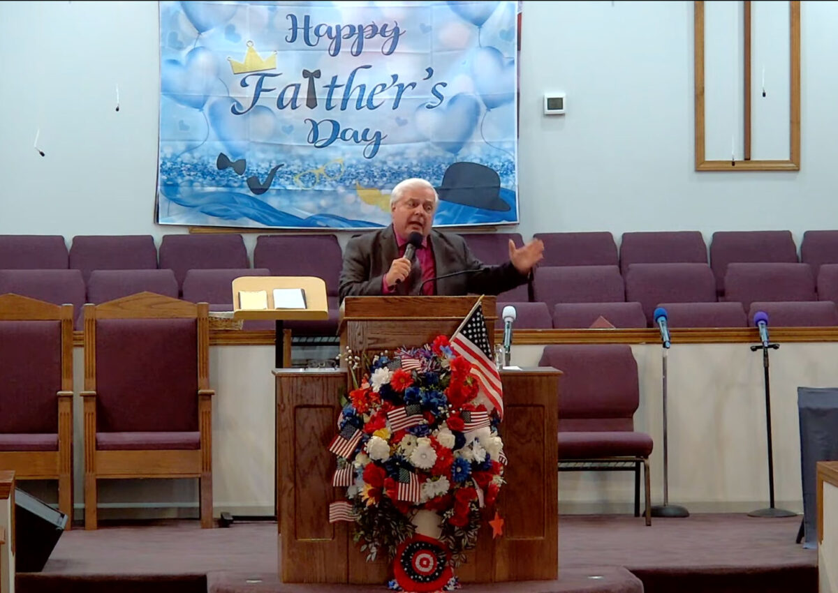 Willard Griffin preaching.
