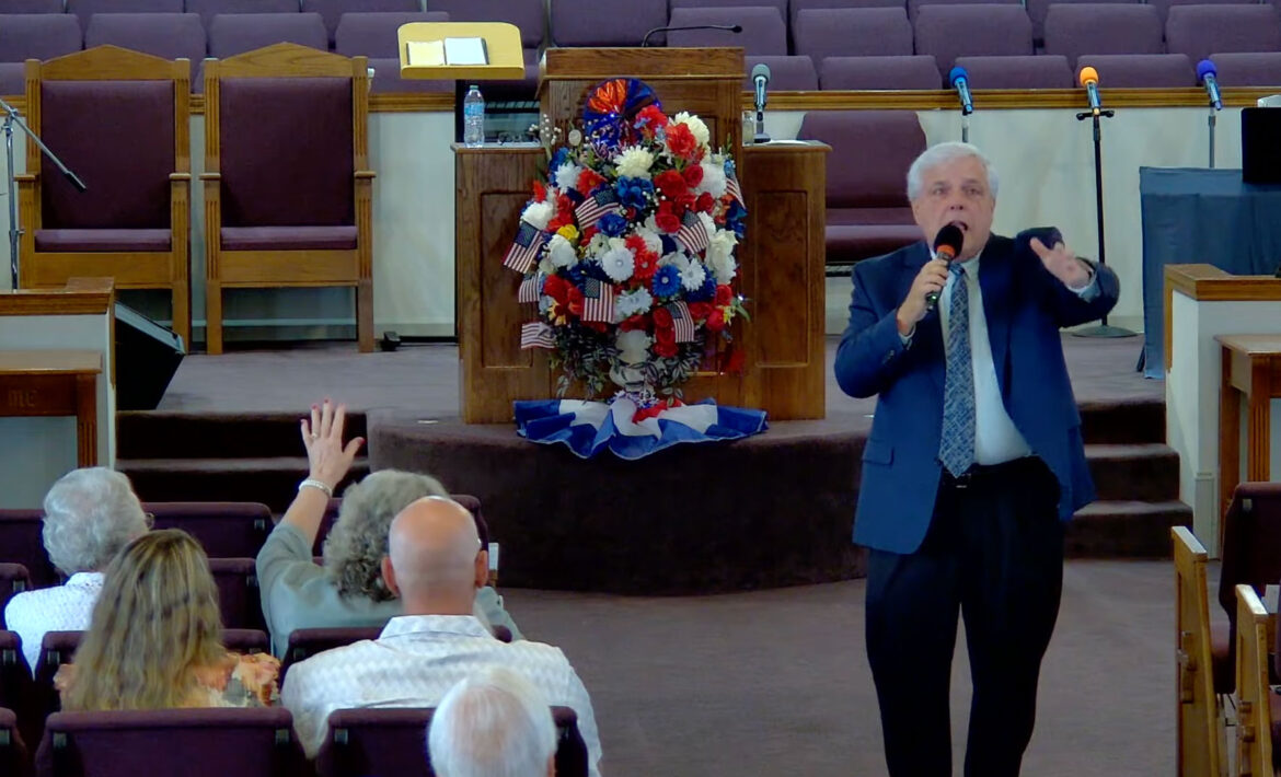 Willard Griffin preaching.