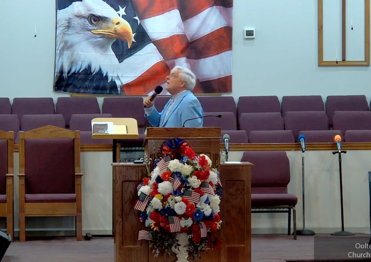 Willard Griffin preaching.