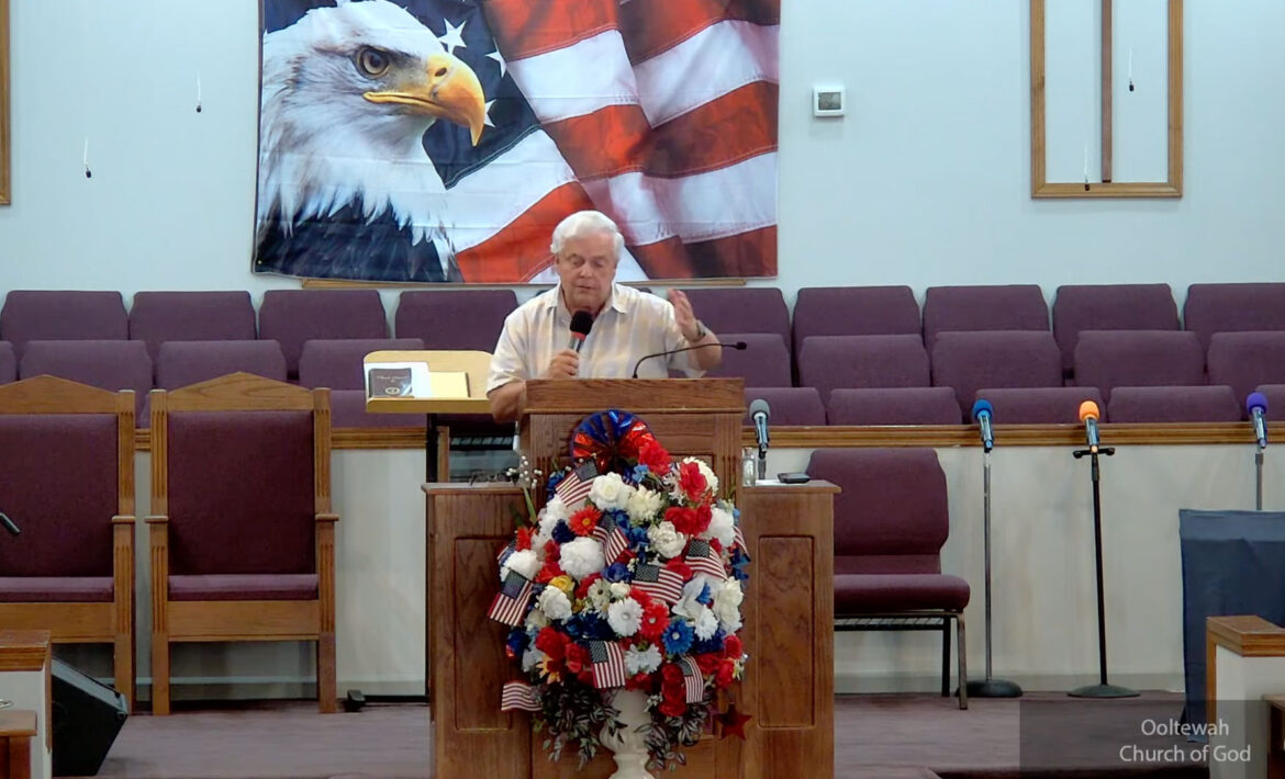 Willard Griffin preaching.