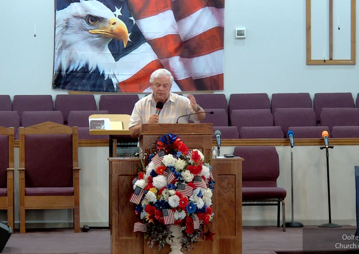 Willard Griffin preaching.