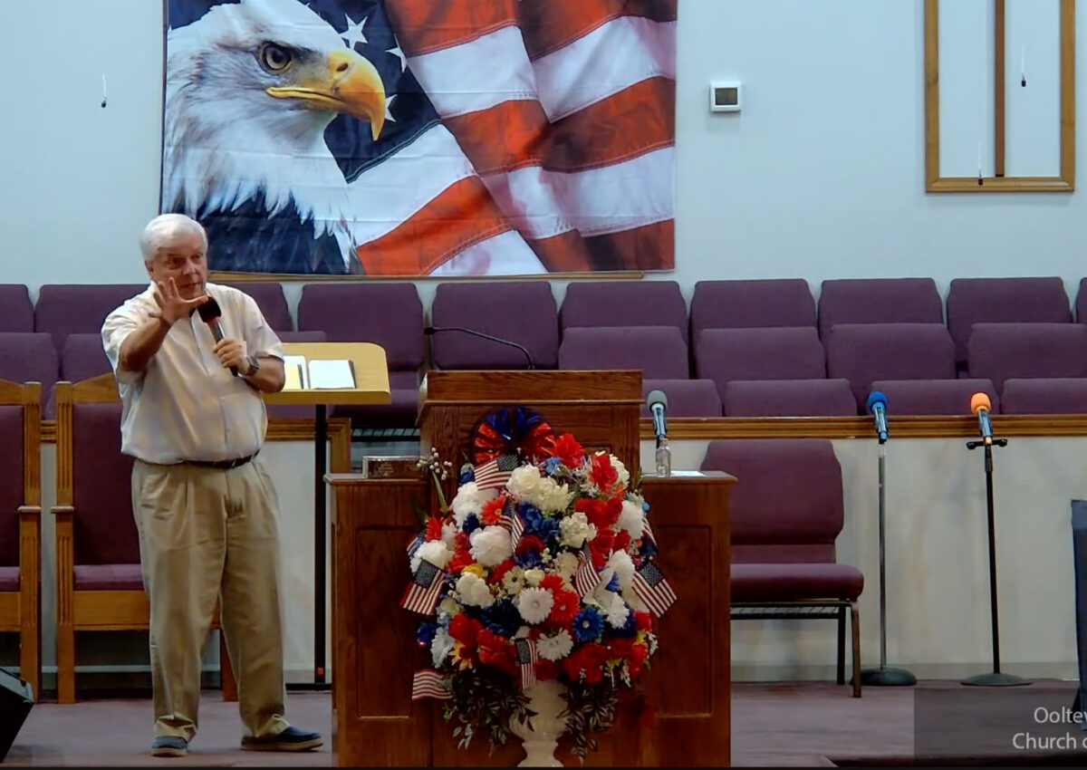 Willard Griffin preaching.