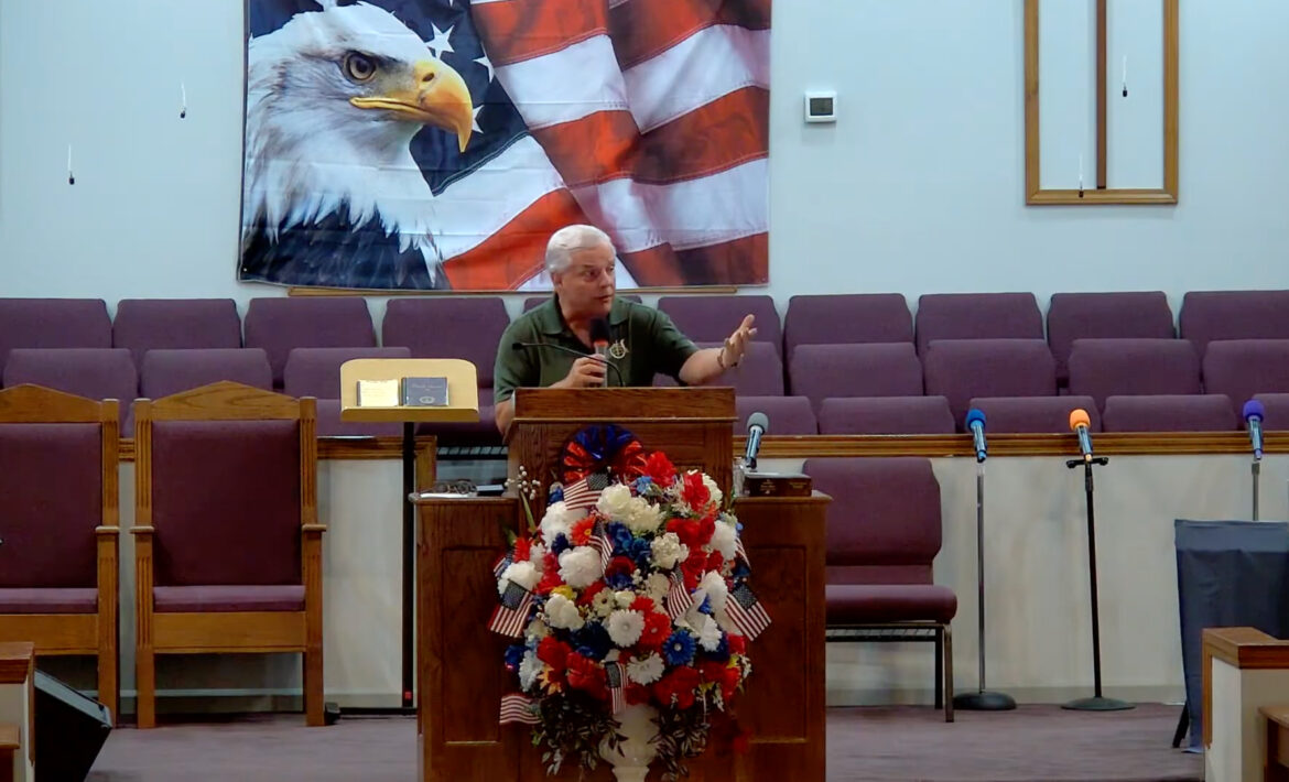 Willard Griffin preaching.