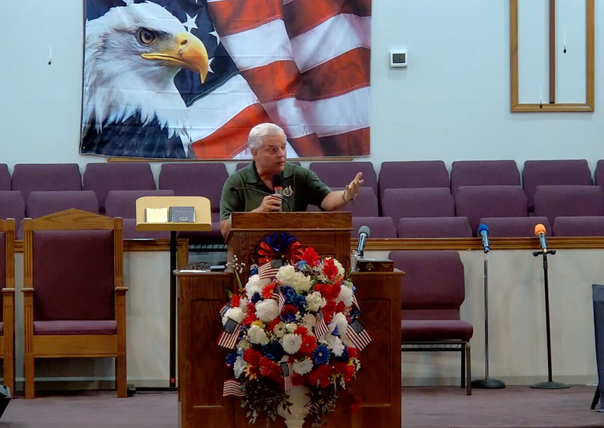 Willard Griffin preaching.