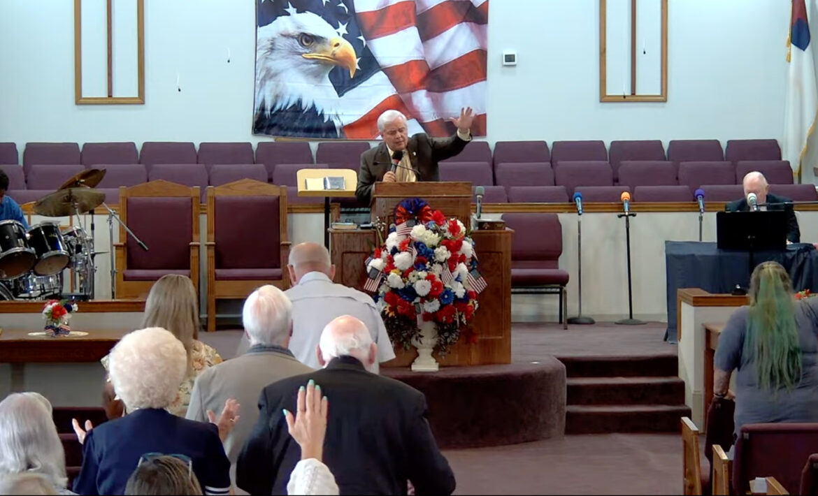 Willard Griffin preaching.
