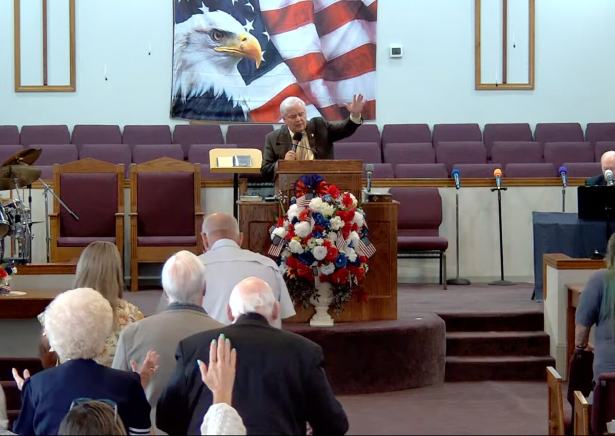 Willard Griffin preaching.