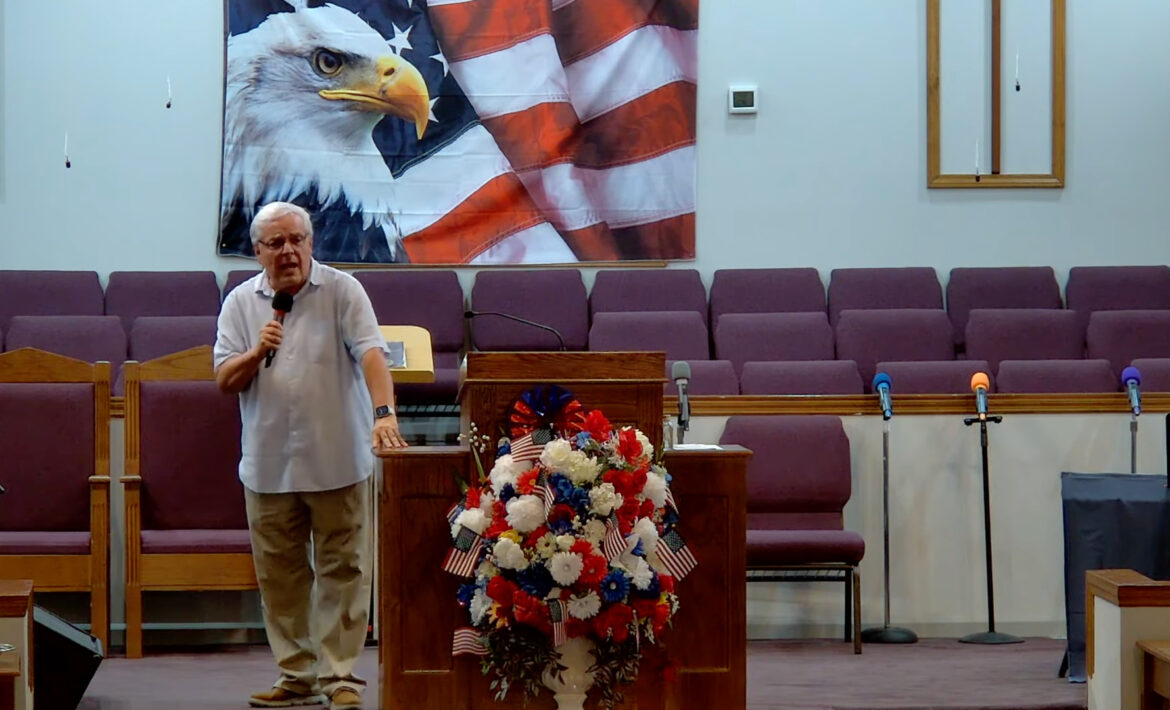 Willard Griffin preaching.