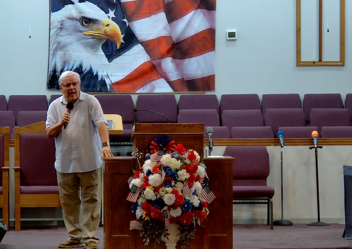 Willard Griffin preaching.