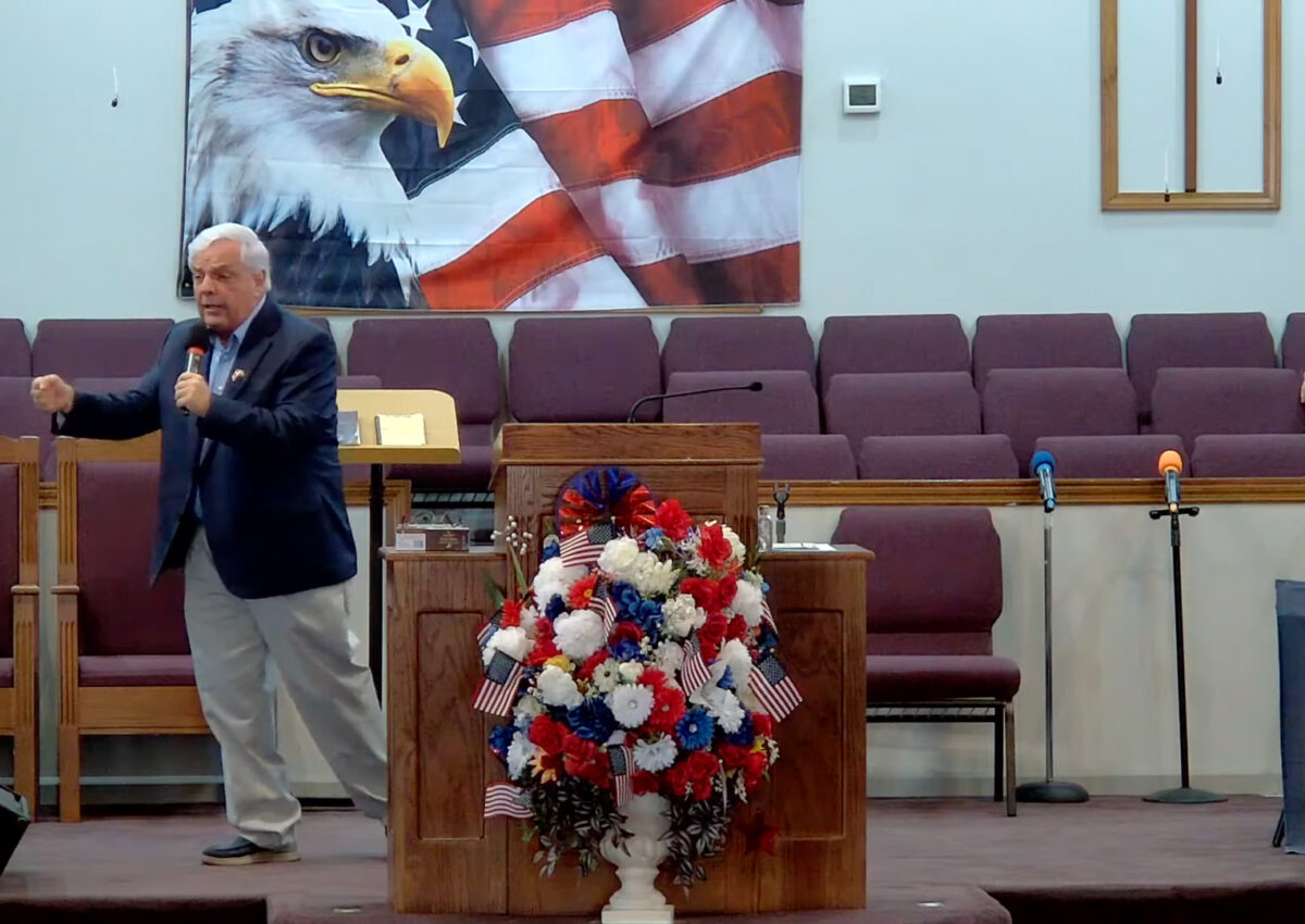 Willard Griffin preaching.