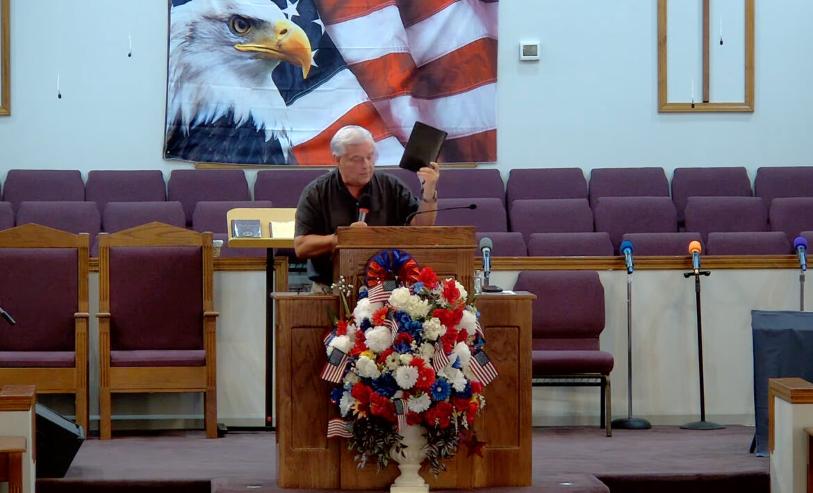 Willard Griffin preaching.