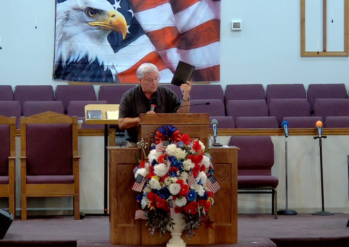 Willard Griffin preaching.