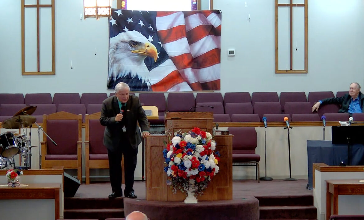 Willard Griffin preaching.