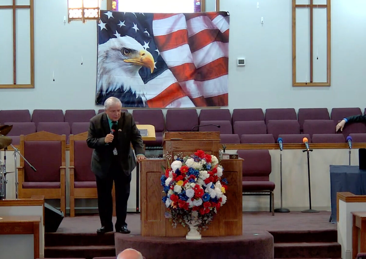 Willard Griffin preaching.