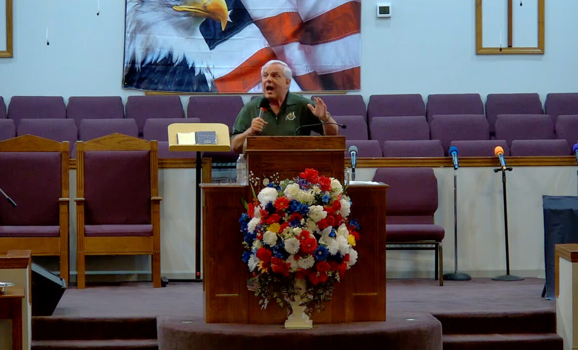 Willard Griffin preaching.