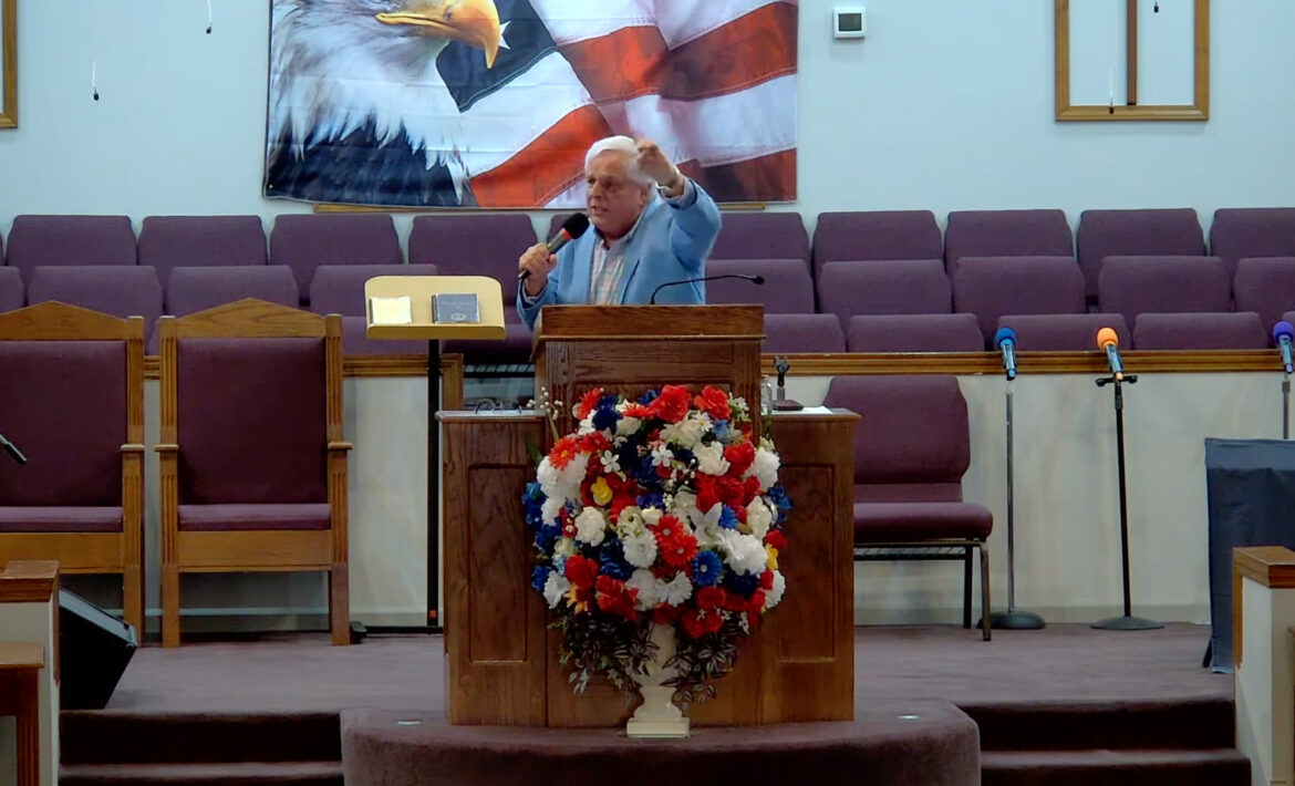 Willard Griffin preaching.