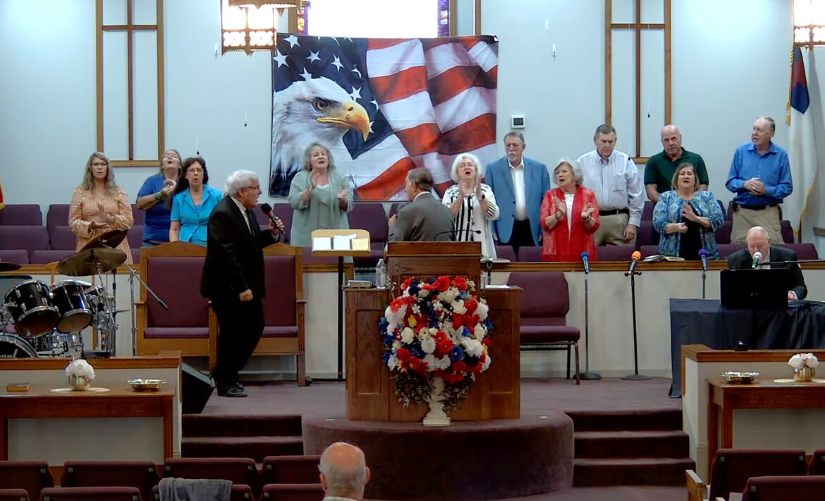 Willard Griffin preaching.