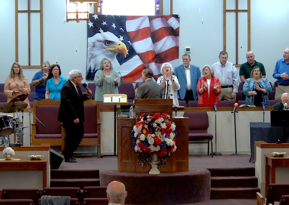 Willard Griffin preaching.