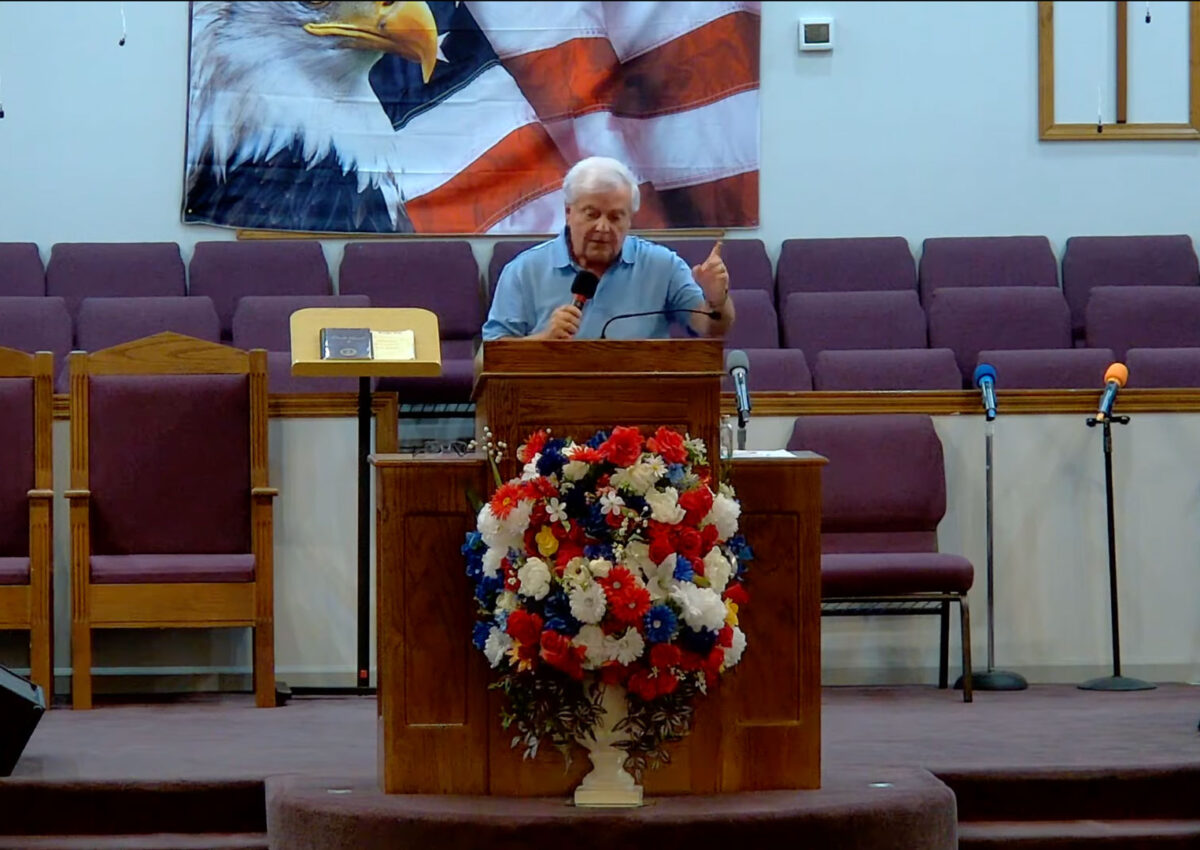 Willard Griffin preaching.