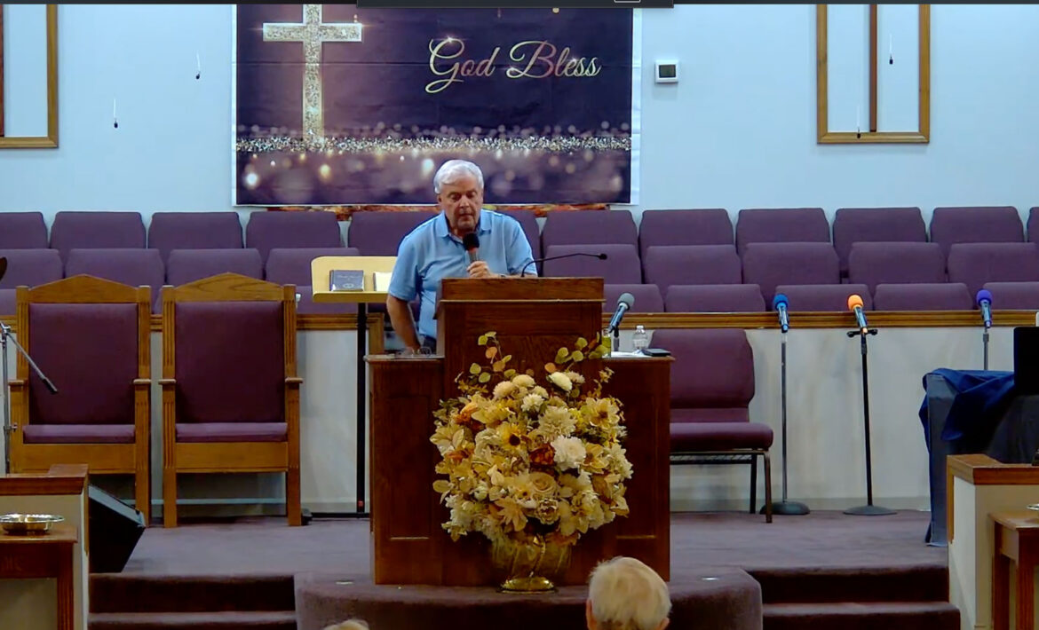 Willard Griffin preaching.