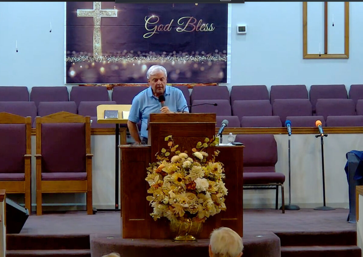 Willard Griffin preaching.