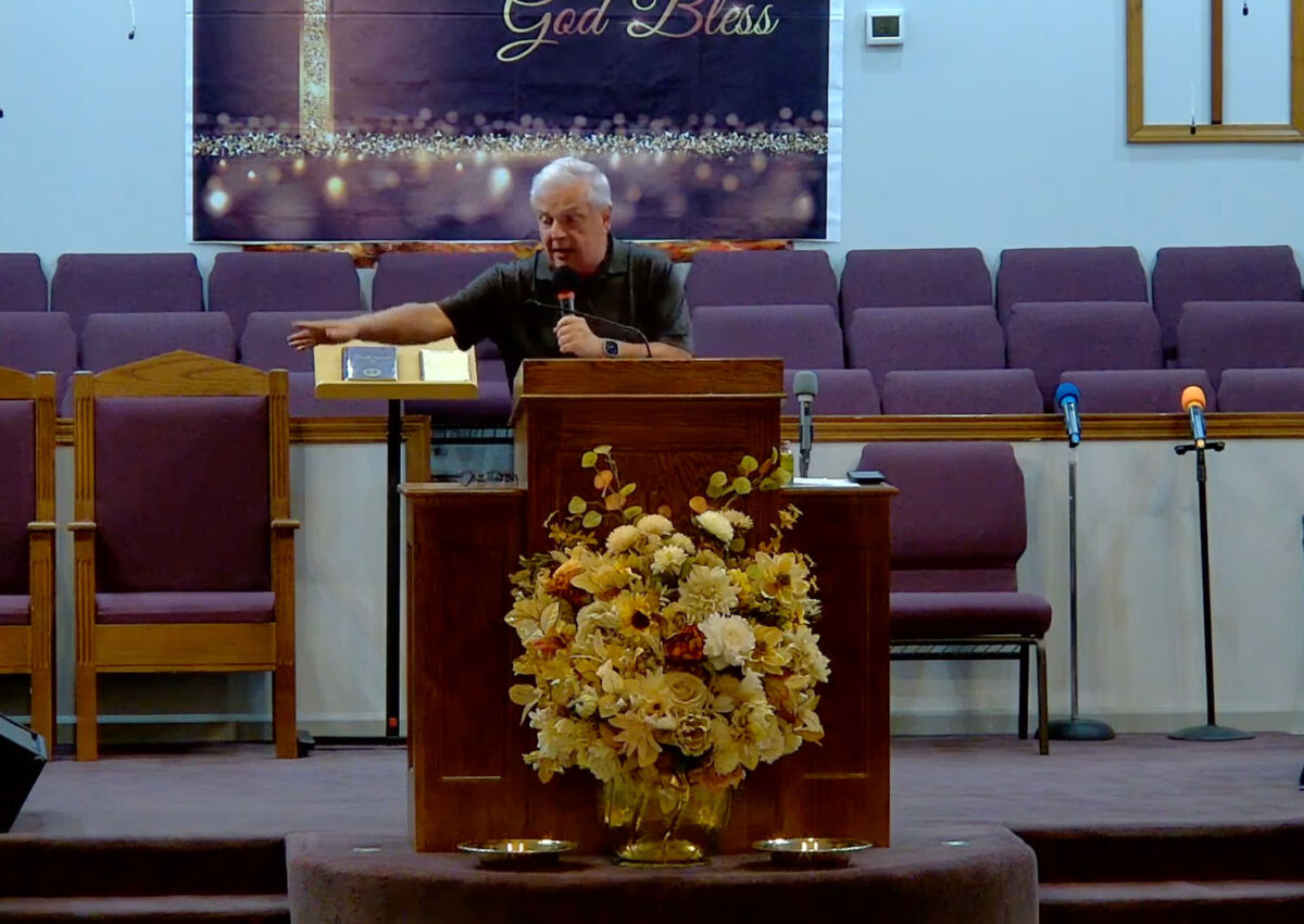Willard Griffin preaching.