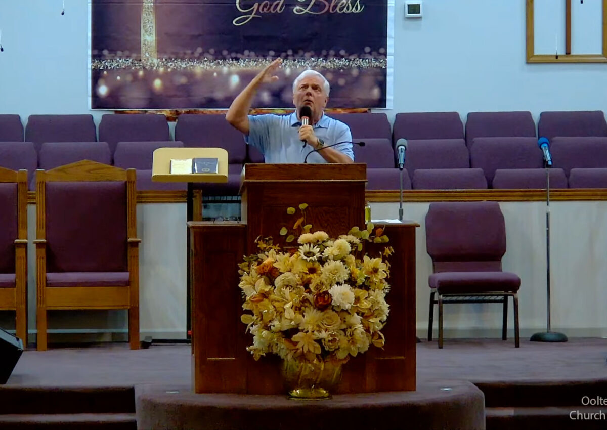 Willard Griffin preaching.